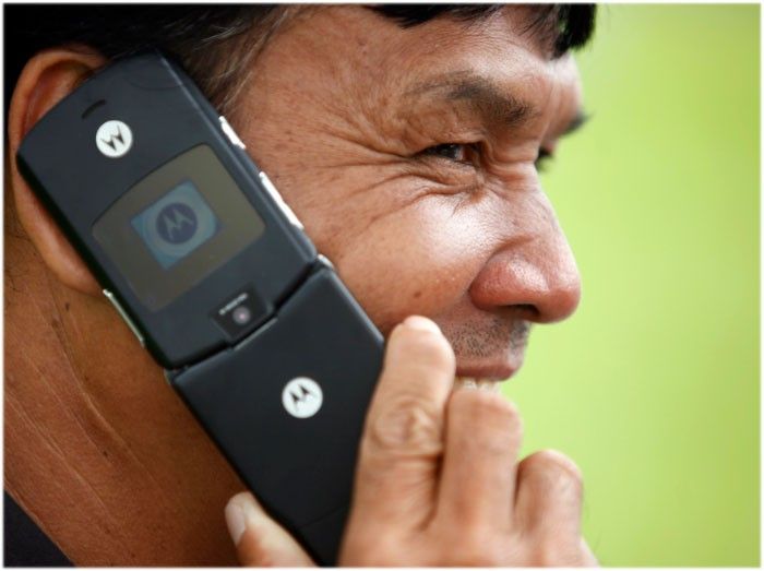 A man uses his Motorola mobile phone 