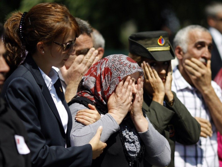 Relatives of Turkish soldier Onur Karakus cry during a funeral ceremony in Istanbul