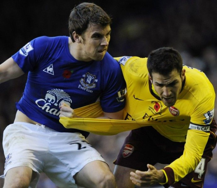 Everton's Coleman challenges Arsenal's Fabregas during their English Premier League soccer match in Liverpool.