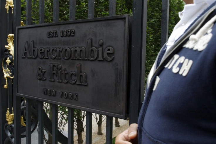 A man stands outside clothing store retailer Abercrombie & Fitch on the opening day in Paris