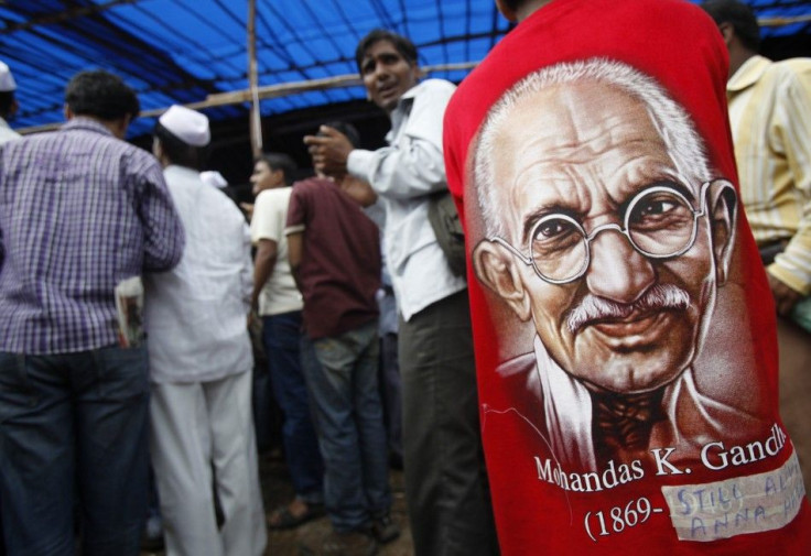 A supporter of veteran Indian social activist Anna Hazare wearing t-shirt with portrait of Mahatma Gandhi participates in a protest rally against corruption in Mumbai