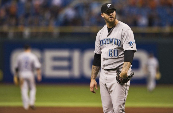 Toronto Blue Jays&#039; Rauch looks away after giving up a game-tieing home run to Tampa Bay Rays during their MLB baseball game in St. Petersburg