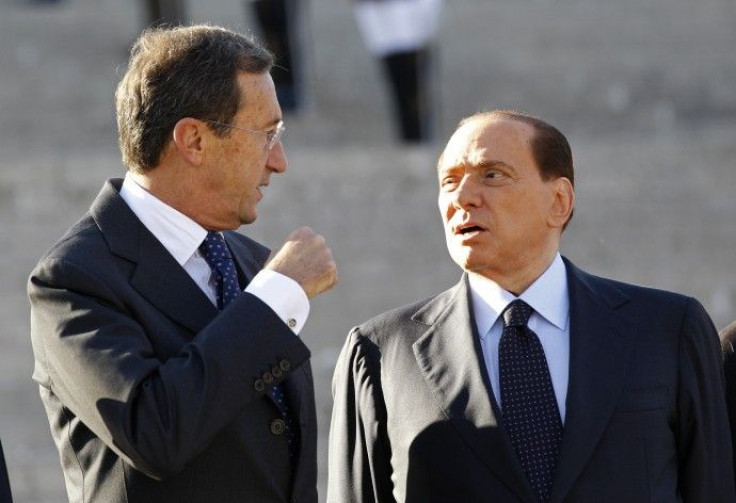 Berlusconi govt. wobbles as Fini loyalists quit