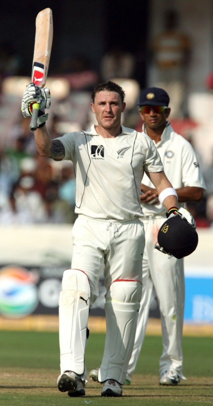 New Zealand's Brendon McCullum (L) celebrates after scoring a century on the fourth day of the second test cricket match in the southern Indian city of Hyderabad November 15, 2010. 
