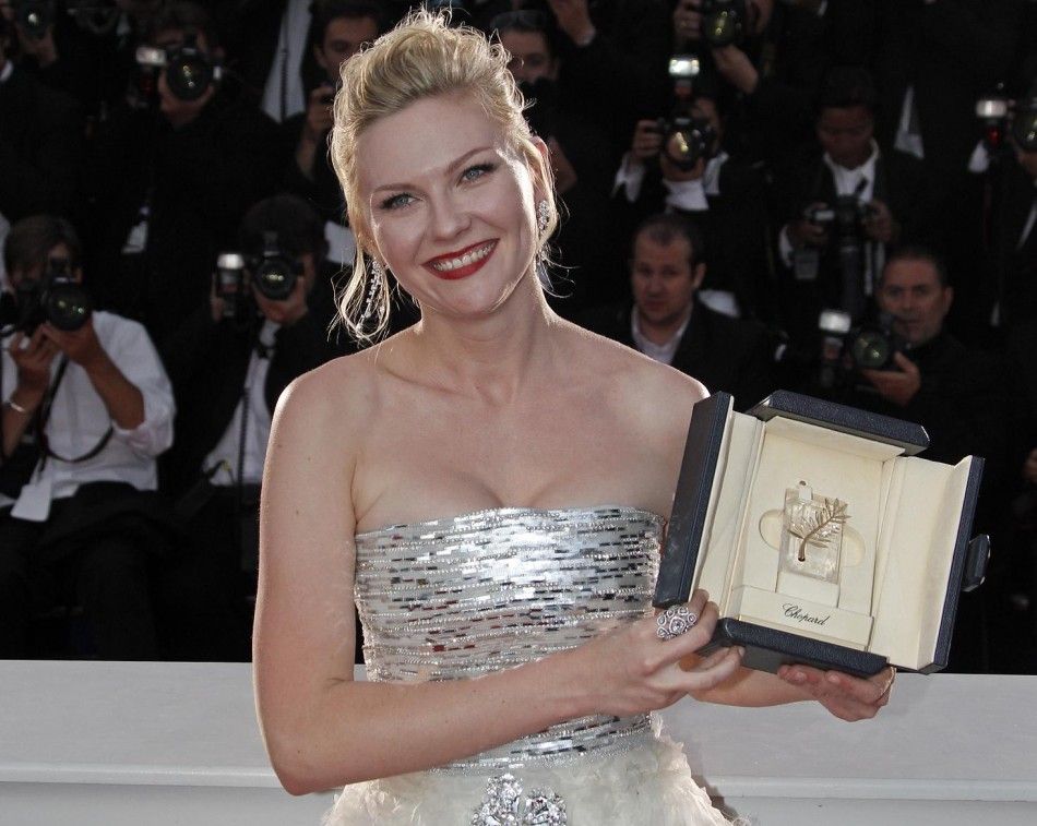 Kirsten Dunst with the Best Actress award, at the 64th Cannes Film Festival