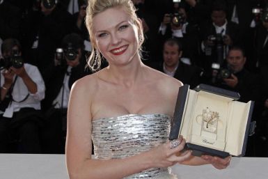 Kirsten Dunst with the 'Best Actress' award, at the 64th Cannes Film Festival