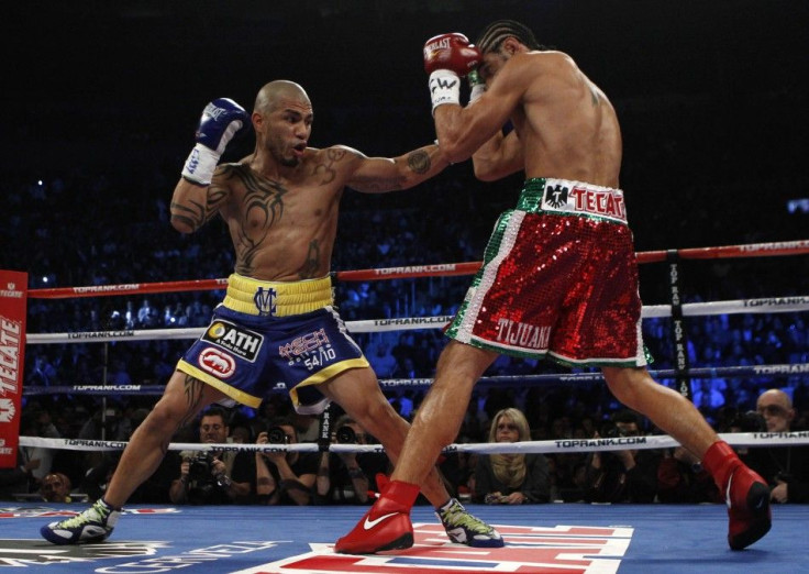 Miguel Cotto battles Antonio Margarito during their WBA Junior Middleweight Championship boxing match in New York on Dec. 4, 2011.
