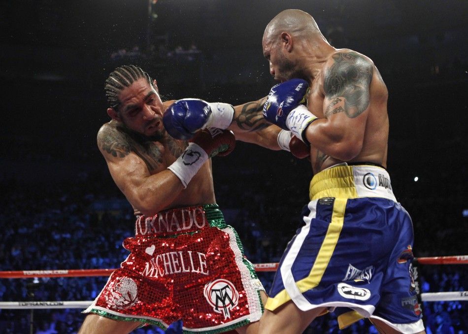 Miguel Cotto lands a right hand to the head of Antonio Margarito during their WBA Junior Middleweight Championship boxing match in New York