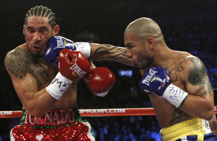 Miguel Cotto lands a right hand to the head of Antonio Margarito during their WBA Junior Middleweight Championship boxing match in New York