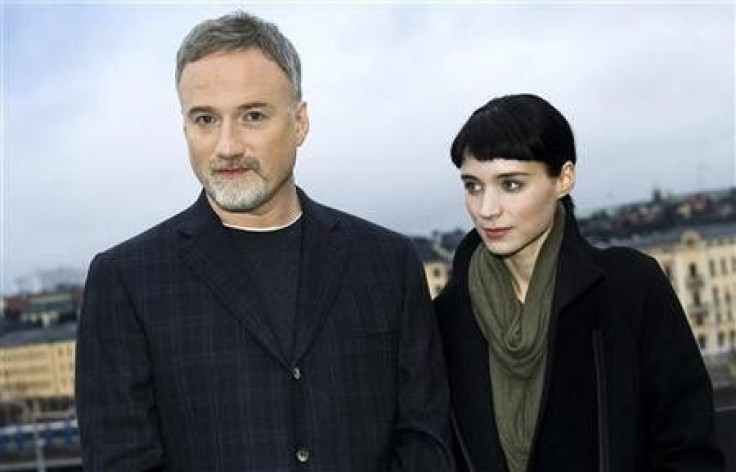 Actress Rooney Mara and director David Fincher pose during a press meeting in Stockholm