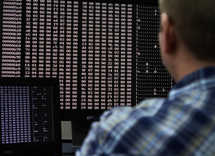 An analyst looks at code in the malware lab of a cyber security defense lab at the Idaho National Laboratory