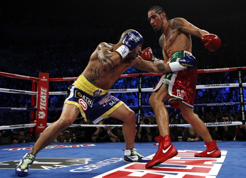 Cotto of Puerto Rico battles Margarito of Mexico during their WBA World Junior Middleweight championship boxing match at New York