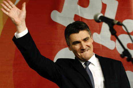 Croatian centre-left opposition party leader Zoran Milanovic celebrates in the parliamentary election after exit polls showed they won a majority in parliament, in Zagreb