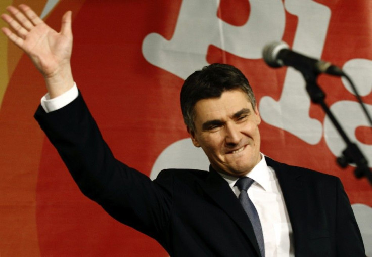 Croatian centre-left opposition party leader Zoran Milanovic celebrates in the parliamentary election after exit polls showed they won a majority in parliament, in Zagreb