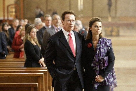 California Governor Arnold Schwarzengger and his wife Maria Shriver (R) attend funeral services for Italian film producer Dino De Laurentiis in Los Angeles