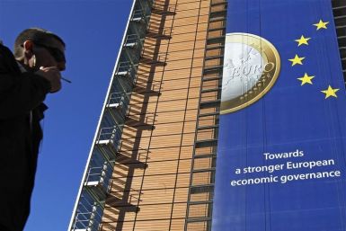 A banner featuring a Euro coin is seen on the European Commission headquarters building. The European Commission approved J&J's purchase of Synthes Inc. on Thursday.