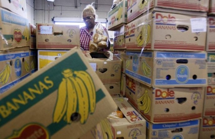 A woman packages donated food at the Los Angeles Regional Food Bank in Los Angeles
