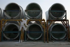 A worker paints wind turbines at China Ming Yang Wind Power Zhongshan Ming Yang electric factory in Zhongshan, southern Chinese province of Guangdong