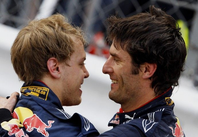 Red Bull Formula One driver Webber of Australia celebrates with his teammate Sebastian Vettel of Germany, who finished, after winning the Monaco F1 Grand Prix on 16/05/2010.