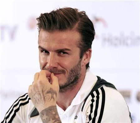 Los Angeles Galaxy's David Beckham reacts during a news confrence in Jakarta