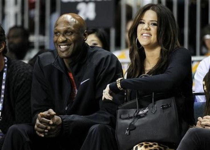 Los Angeles Lakers&#039; Lamar Odom and his wife television personality Khloe Kardashian sit courtside as they attend the 2011 BBVA All-Star Celebrity basketball game as a part of the NBA All-Star basketball weekend in Los Angeles