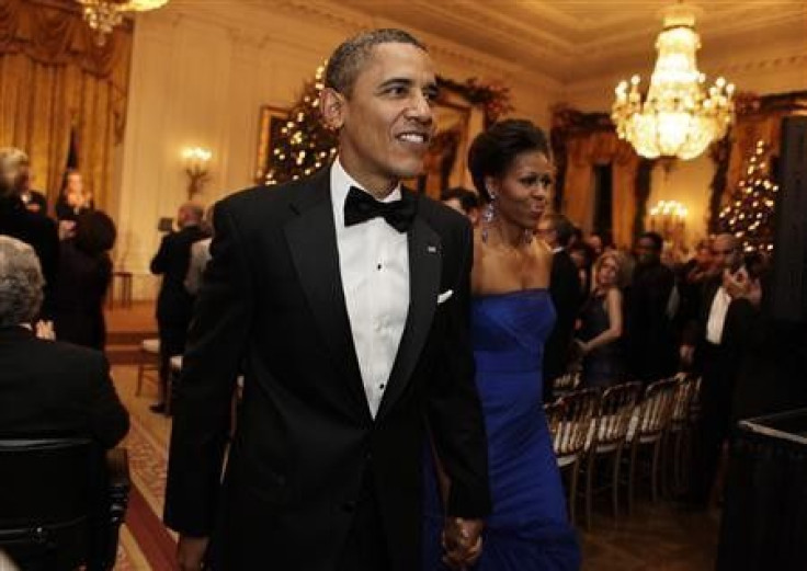 U.S. President Barack Obama and first lady Michelle Obama leave after the Kennedy Center Honors reception at the White House in Washington