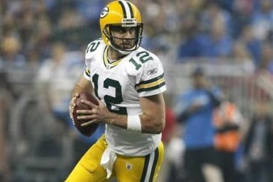Green Bay Packers quarterback Aaron Rodgers looks for his receiver during the second half of their NFL football game against the Detroit Lions in Detroit, Michigan