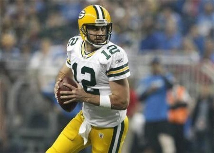 Green Bay Packers quarterback Aaron Rodgers looks for his receiver during the second half of their NFL football game against the Detroit Lions in Detroit, Michigan