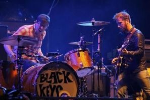 The Black Keys guitarist Dan Auerbach looks over at drummer Patrick Carney as they play on the main stage at the Coachella Valley Music & Arts Festival in Indio, California