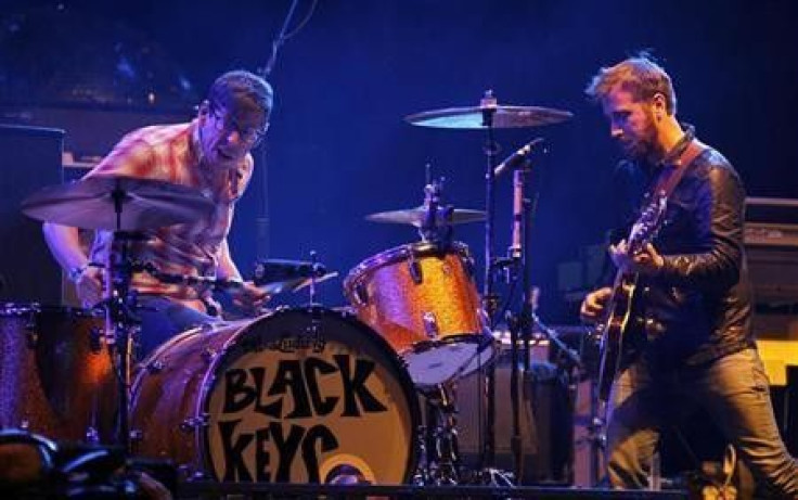 The Black Keys guitarist Dan Auerbach looks over at drummer Patrick Carney as they play on the main stage at the Coachella Valley Music & Arts Festival in Indio, California