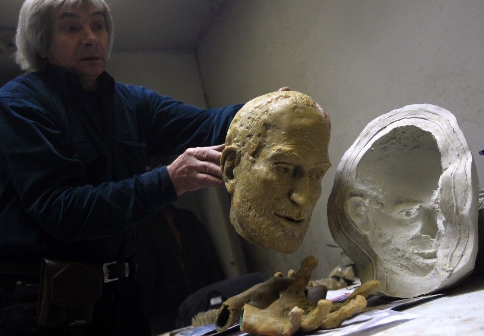 Hungarian sculptor Erno Toth works on a wax model for a new bronze statue of late Apple co-founder Steve Jobs in Budapest