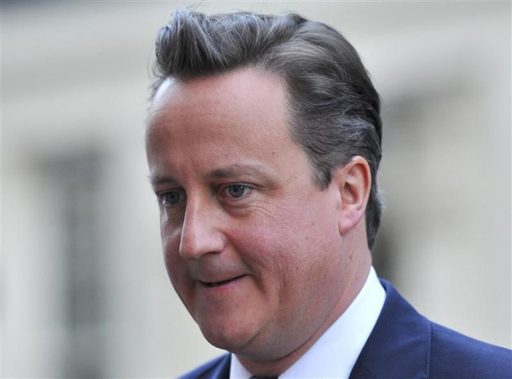 Prime Minister Cameron leaves Downing Street in London