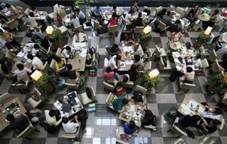 People work at a cafe in Taipei in this July 31, 2009 file photo.