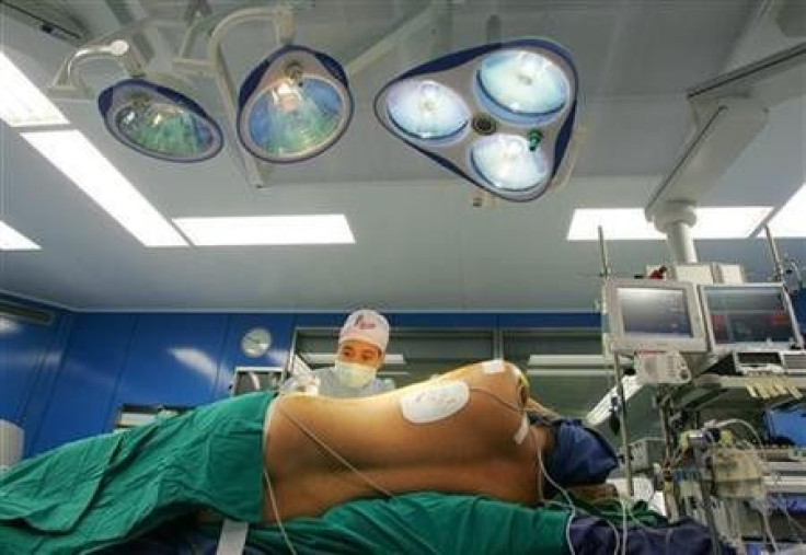A patient is prepared for a two-hour surgery that will involve injecting stem cells cultivated from the patient's blood, at Bangkok Heart Hospital, in December 2005.