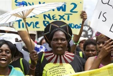 Environmental activists demonstrate outside the United Nations Climate Change conference (COP17) in Durban December 3, 2011. The protest march was part of a Global Day of Action to demand a fair climate change deal.