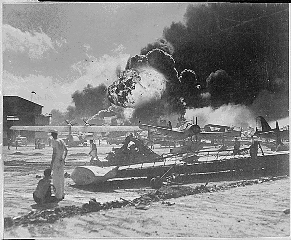 U.S. Servicemen Stand Near Airplane Wreckage on December 7, 1941
