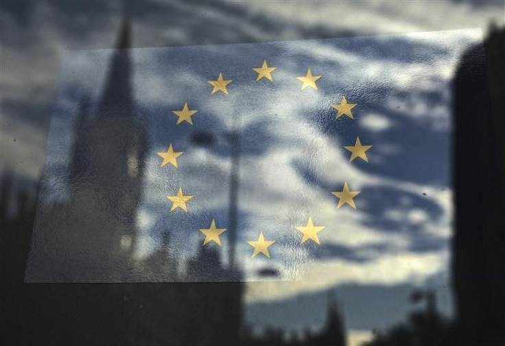 The European Union flag is pictured in a window reflecting a street in London