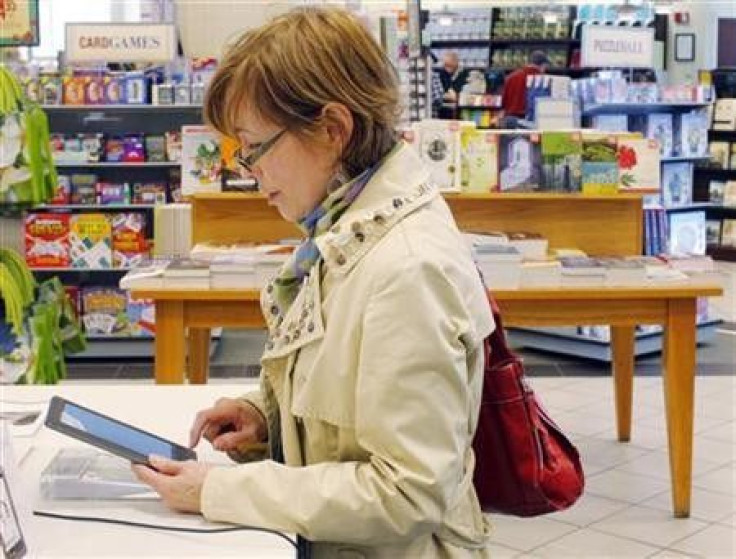 A customer examines a Nook e-reader at a Barnes and Noble store in Boston, March 18, 2011.