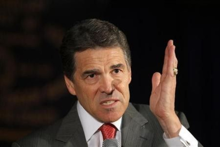 Republican presidential candidate Texas Governor Rick Perry answers a question from the audience at a town hall campaign stop in Nashua, New Hampshire