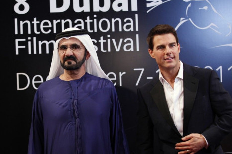 Sheikh Mohammed bin Rashid Al Maktoum (L), vice-president of the UAE and ruler of Dubai, poses at the red carpet with U.S. actor Tom Cruise as they arrive during the opening ceremony of the 8th Dubai International Film Festival for the premiere of Cruise&