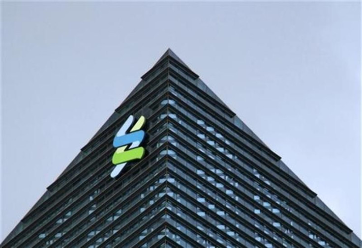 The logo of Standard Chartered is seen at its new Singapore office at the Marina Bay Financial Centre