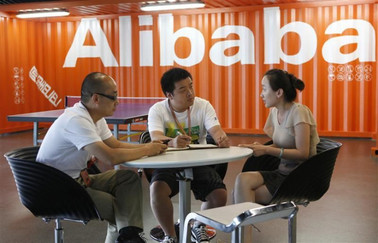Employees hold a meeting inside the headquarters office of Alibaba (China) Technology Co. Ltd on the outskirts of Hangzhou.