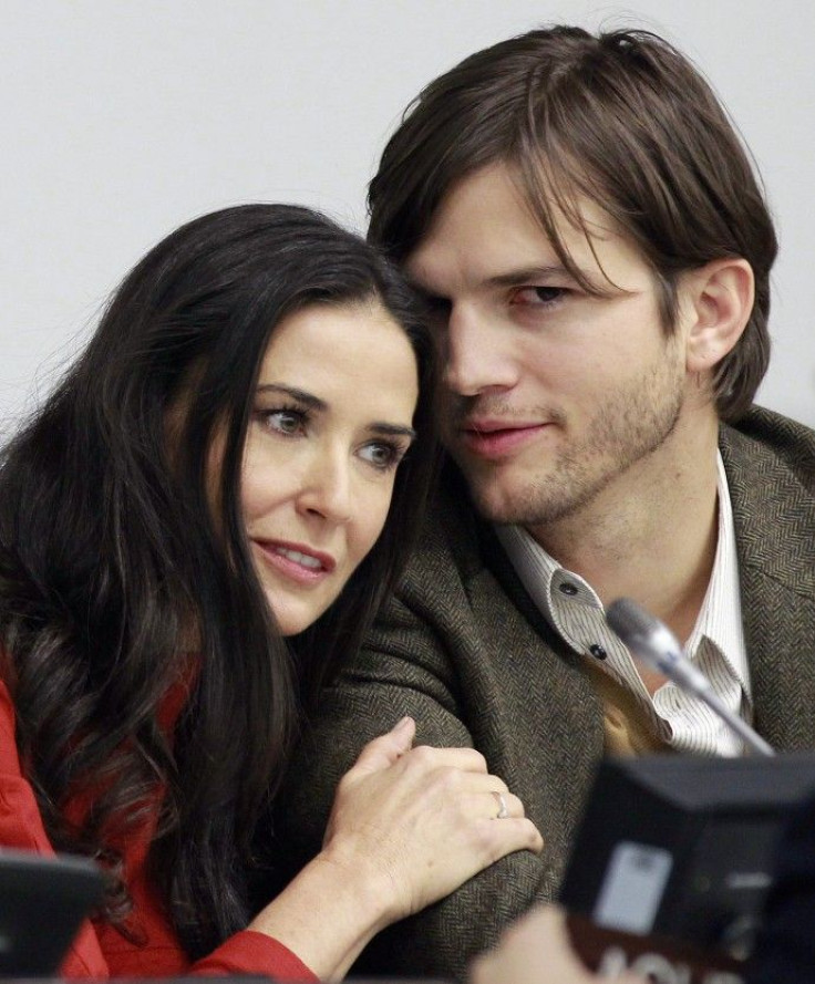 Actress Demi Moore and her husband actor Ashton Kutcher attend a news conference at the United Nations Headquarters in New York