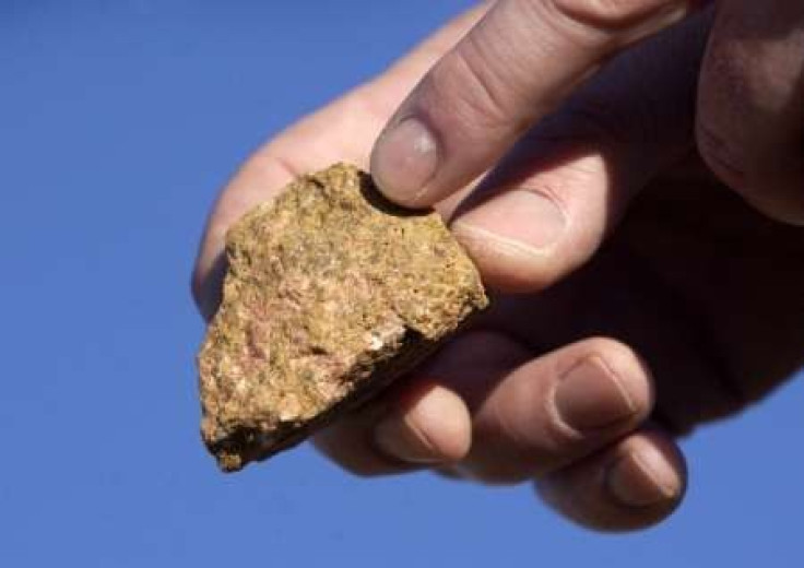 A piece of bastnasite ore, which contains rare earth elements, is shown by Brock O'Kelly from Molycorp Minerals Mountain pass Mine in Mountain Pass, Califonia August 19, 2009. 