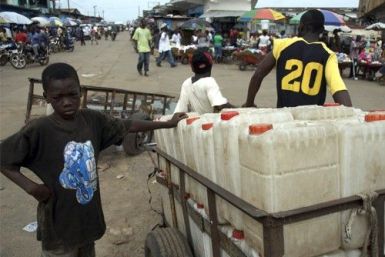 A boy sells jerrycans at a market area in the Liberian capital of Monrovia