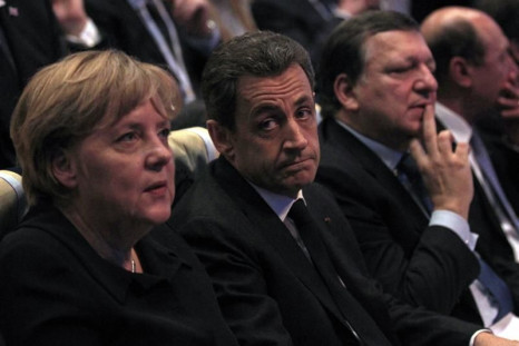 France's President Sarkozy sits next to German Chancellor Merkel and European Commission President Barroso at the EPP congress in Marseille