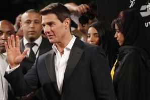 U.S. actor Tom Cruise waves as he arrives at the opening ceremony of the 8th Dubai International Film Festival for the premiere of his new movie &#039;&#039;Mission Impossible: Ghost Protocol&#039;&#039;