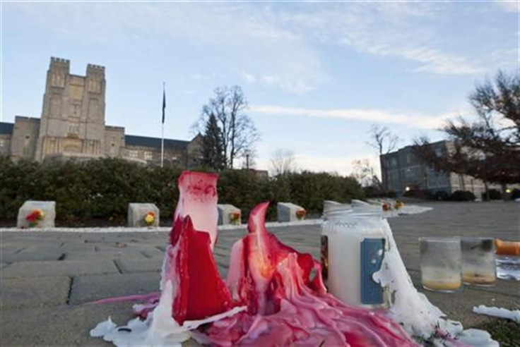 A candle burns at a memorial for the fallen Virginia Tech police officer in Blacksburg