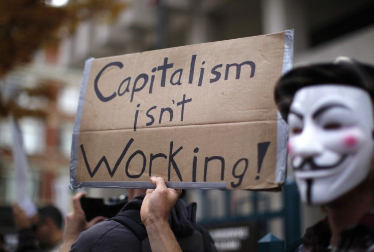 Occupy Denver protesters rally in front of the U.S. Federal Reserve bank in downtown Denver