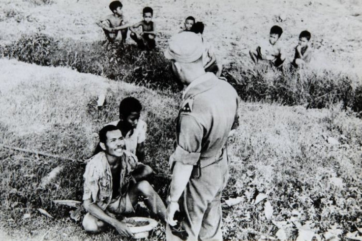 Dutch soldier interrogating Indonesians